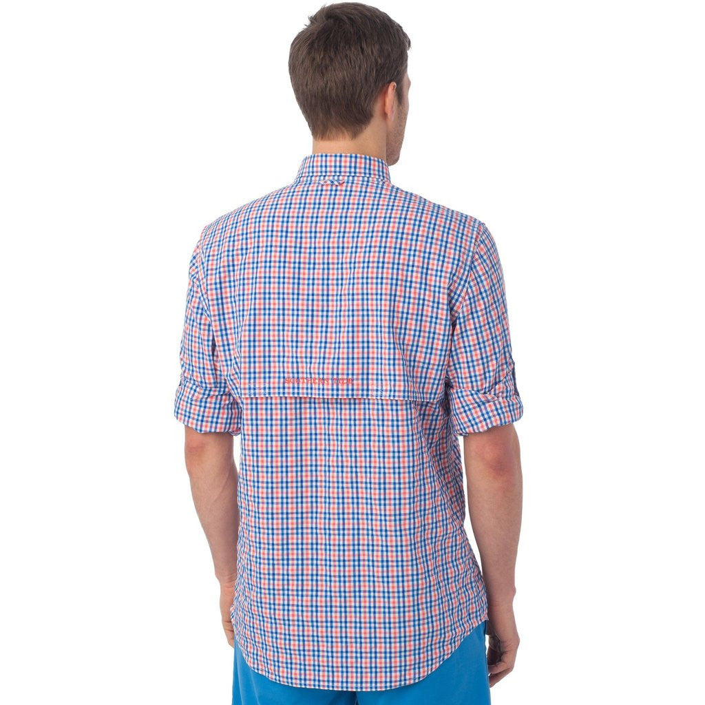 https://www.tideandpeakoutfitters.com/cdn/shop/products/Tarpon_Plaid_Fishing_Shirt_in_Hot_Coral_by_Southern_Tide1_2048x.jpg?v=1571308696